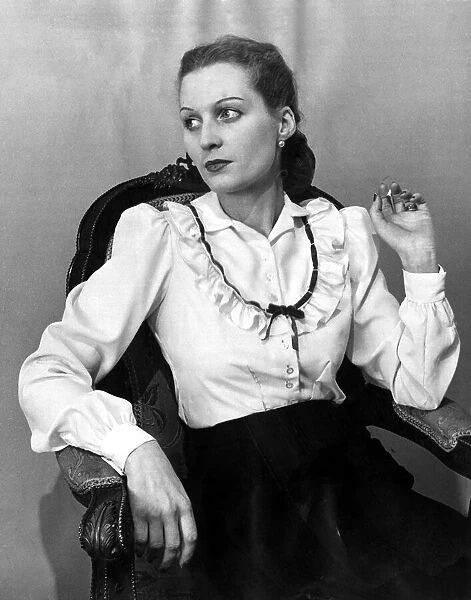 Two-way blouse Fashion clothing shoot January 1948 Woman reclining in chair