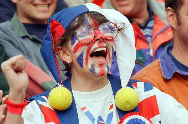 A Union Jack Face Painted fan of Tim Henman support the English tennis player during his