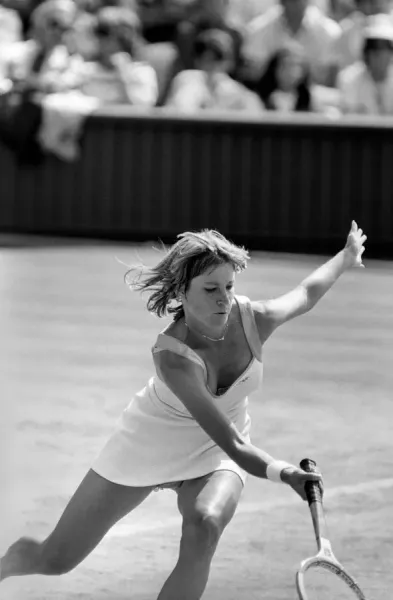 Tennis player Chris Evert Lloyd of the USA hits a forehand return