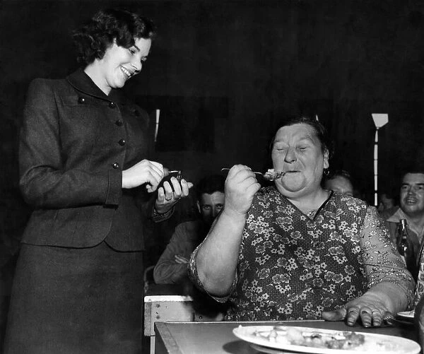 Woman eating dinner in the canteen at a labour factory. August 1952 P009089