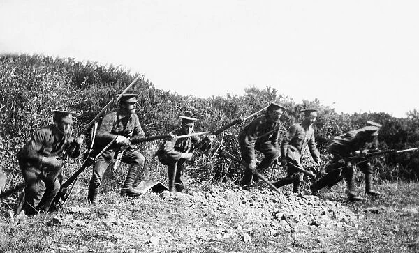 World War I British troops charging from the trenches. The trenches of World War I have