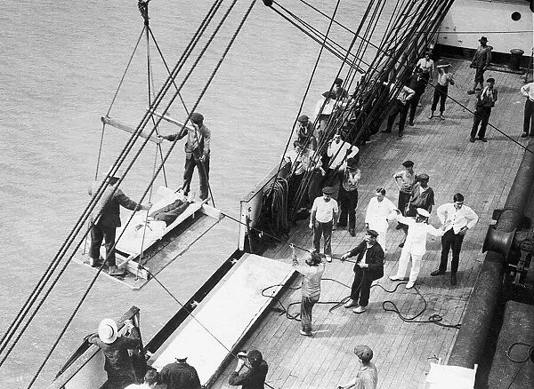 World War I wounded British soldiers are taken on board the hospital ship Pegasus. 1914