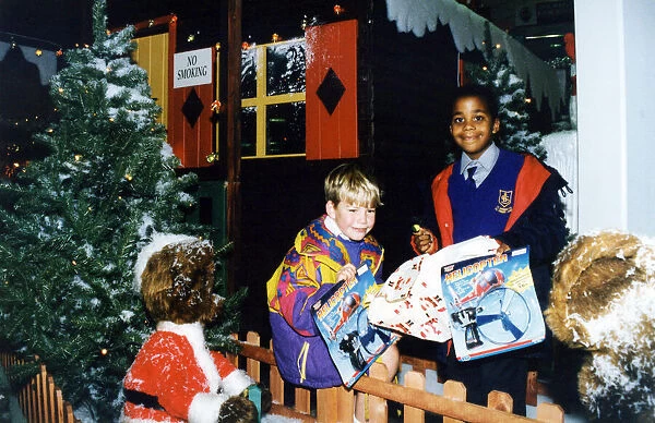 Young helpers, Smiley Crabbe, on the right, and Sean Behan pictured outside Santa