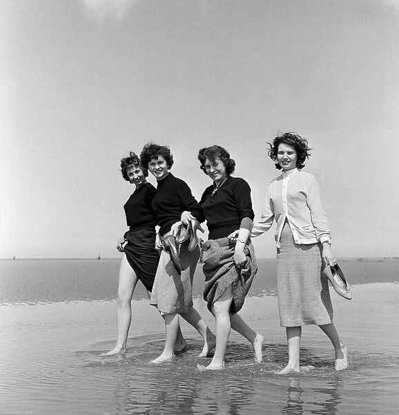 These young ladies, office workers, took a lunch hour paddle at Rhyl which has its