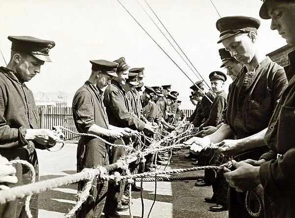 Young Sailors learning skills - September 1942, standing in line, tying knots with rope