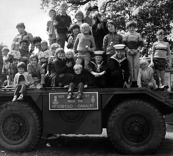 Some of the youngsters at the St Helens show enjoy a look over an armoured scout car