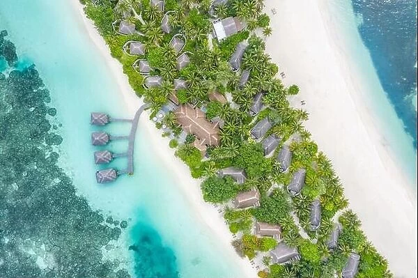 Amazing bird eyes view in Maldives, landscape seascape aerial view over a Maldives. Landscape, luxury tropical resort or hotel with water villas beach