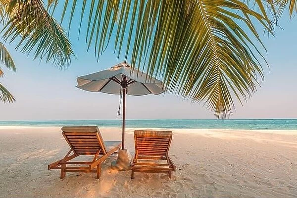 Beautiful sunset relax beach. Chairs on sandy beach near the sea. Summer holiday and vacation concept for tourism. Inspire romance tropical landscape