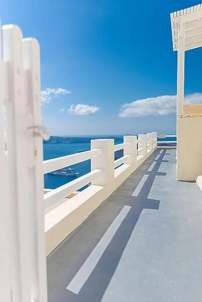 Fantastic travel background, Santorini urban landscape. Red door, gate with stairs white architecture under blue sky. Idyllic summer vacation luxury