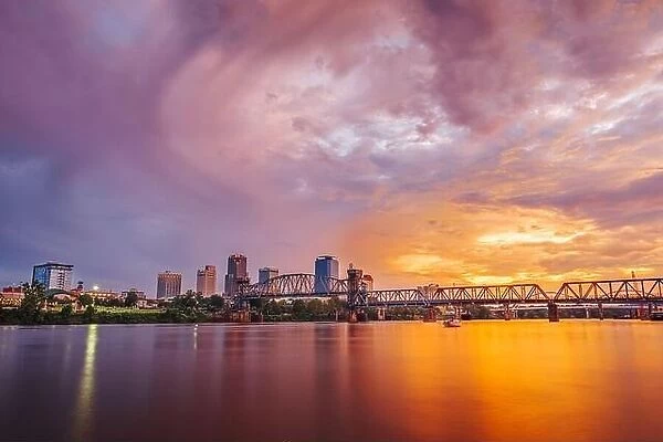 Little Rock, Arkansas, USA downtown skyline on the Arkansas River at dawn