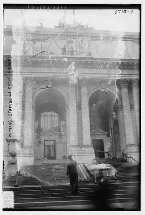 Framed Print : Putting statues on public library Framed Print : Putting statues on public library