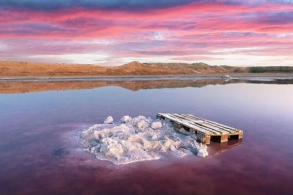 Salt crystals in pink water salt lake in Ukraine, Europe. Landscape photography