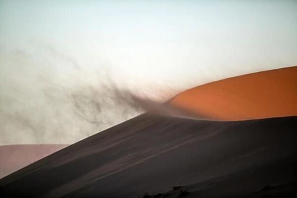 Sand blowing off a sand dune