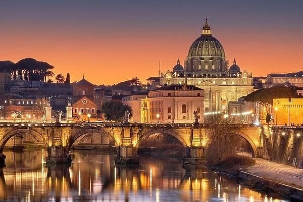 St. Peter's Basilica in Vatican City on the Tiber River through Rome, Italy at dusk