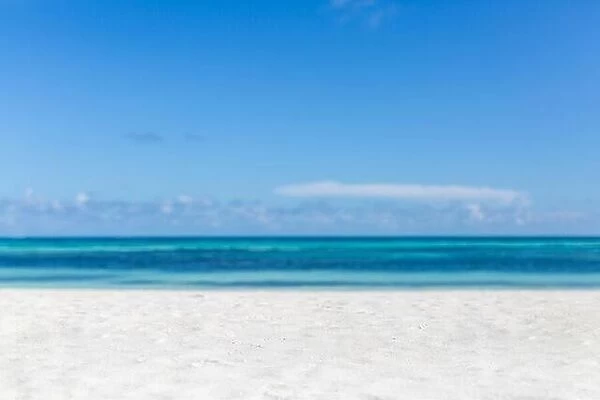 Empty tropical beach background. Horizon with sky and white sand. Paradise island shore or coast