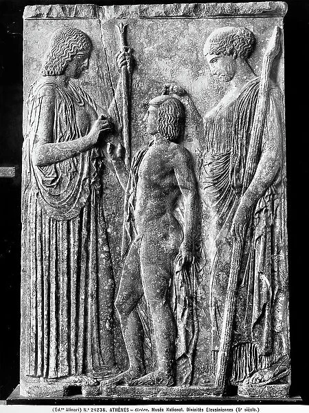The bas-relief shows the three Elesuine divinities: Work on display at the National Museum of Athens