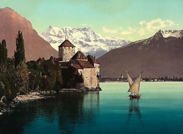 Chillon Castle on the Leman Lake, near Montreux. In the background, the mountain range of the Dent du Midi, Switzerland