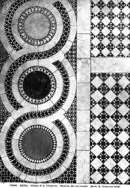 Detail of the cosmatesque mosaic floor of the Basilica of St. Clemente, Rome. The decoration of the floor consists of circles and diamonds