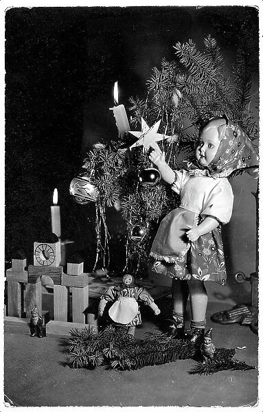 Doll and other toys under a little Christmas tree, Christmas greeting post-card, on the back side a personal dedication and the dispatch date 29th of December 1959, Poland