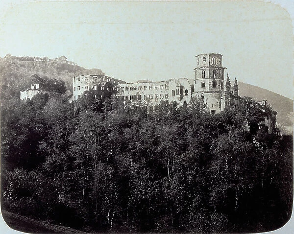 Heidelberg Castle in Germany. In the foreground, thick vegetation of trees