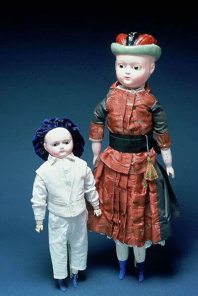 Little boy and Bonnet Doll, in papier-mach and wax, made in Germany in the second half of the Nineteenth century. The original period clothes are in the style of contemporary Romantic period baby clothes