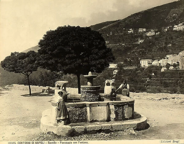 Two little girls take water from a fountain in the environs of Ravello, near Salerno