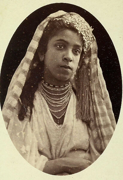 Oval portrait of a young Algerian Moorish lady from the environs of Algeri, in traditional dress