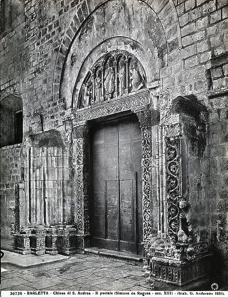 Portal of the Church of S. Andrea, Barletta. The portal is finely sculpted. In the lunette, Christ, The Madonna, John the Baptist and two angels are visible
