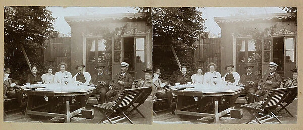Steroscopic photography showing a group of people around a table