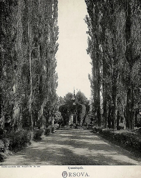 Tree-lined avenue with the Chapel of the Crown in Orsova, Rumania