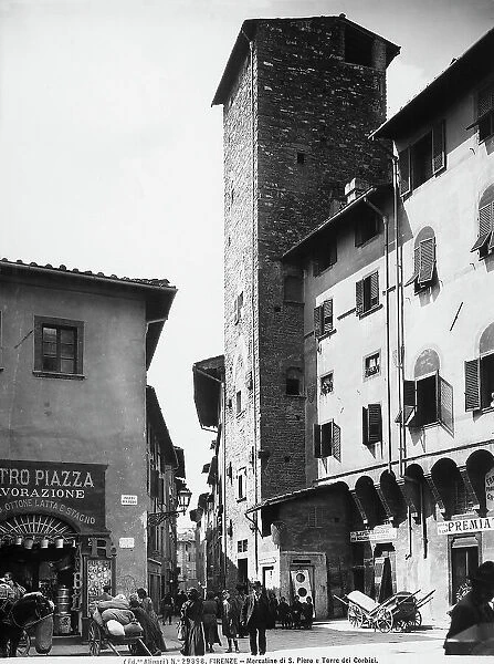 View with people of the Mercatino di San Piero. The Corbizi Tower is in the background