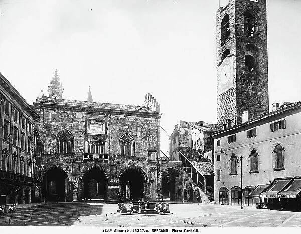 View of Piazza Vecchia, formerly Piazza Garibaldi in Bergamo. On the right rises the Municipal Tower and in the center the fountain donated in the 18th Century by Mayor Contarini