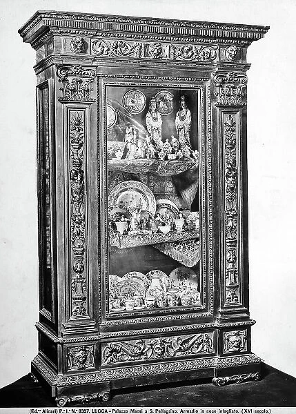 A wardrobe in inlaid walnut from Palazzo Mansi, Lucca. Wardrobe with glass cupboard containing chinaware probably from China