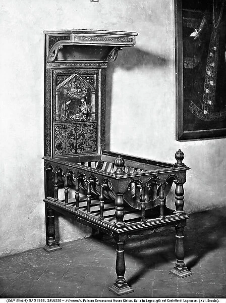 Wooden cradle with a painted and decorated canopy, Palazzo Cavassa, Saluzzo