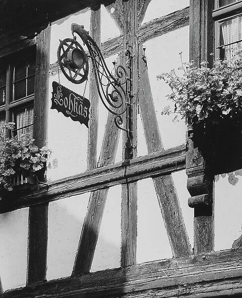 Wrought-iron sign on the facade of a house in Strasbourg