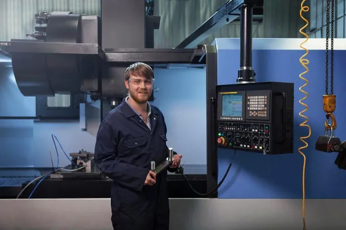 Framed Print : Apprentice Holding U-Bolt Strap Print Framed Print : Apprentice Holding U-Bolt Strap Print