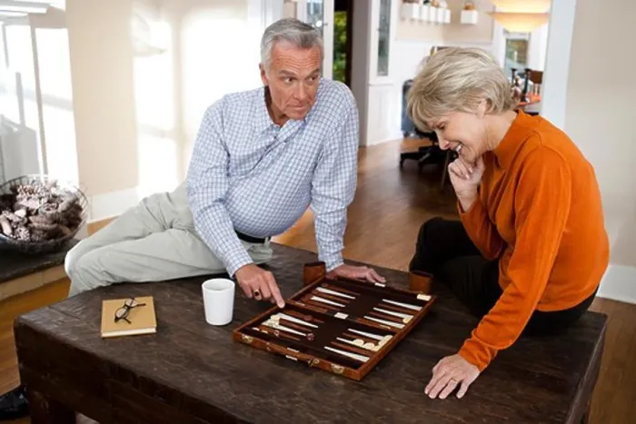 Framed Print : Mature Couple Playing Backgammon Print Framed Print : Mature Couple Playing Backgammon Print