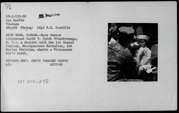 Framed Print : Navy Second Lieutenant David W. Syrek examines a Vietnamese boy's teeth in this print Framed Print : Navy Second Lieutenant David W. Syrek examines a Vietnamese boy's teeth in this print