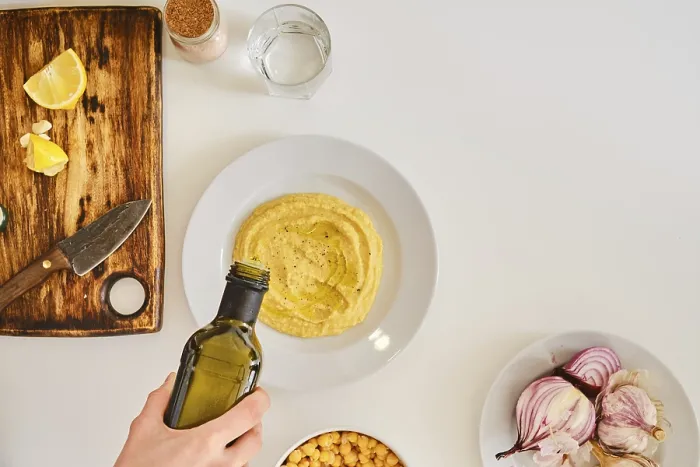 Framed Print : Adding Olive Oil to Hummus Print Framed Print : Adding Olive Oil to Hummus Print