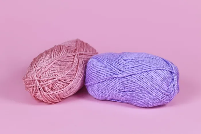 Framed Print : Two Balls of Wool Print on Pink Background Framed Print : Two Balls of Wool Print on Pink Background