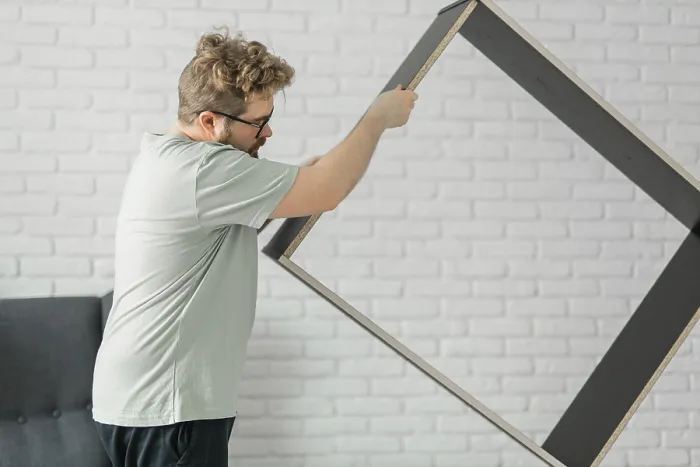 Framed Print : Bearded Millennial Man Assembles Bookcase Print Framed Print : Bearded Millennial Man Assembles Bookcase Print