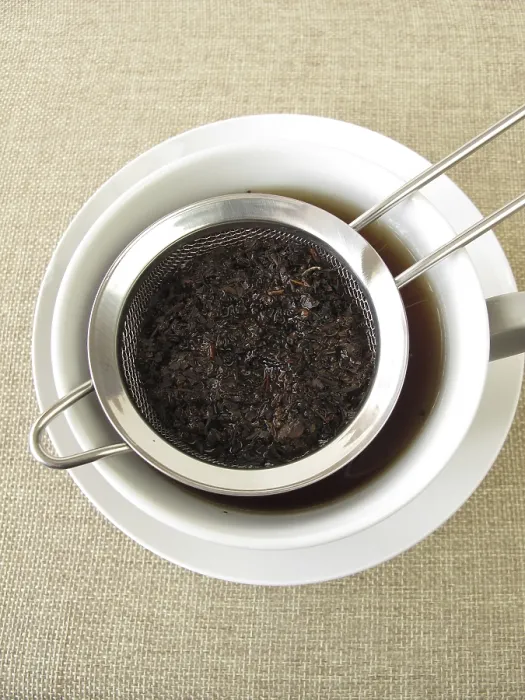 Framed Print : Black Tea in a Tea Strainer Print Framed Print : Black Tea in a Tea Strainer Print