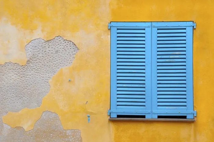 Framed Print : Colourful Blue Shutter Print on Yellow Plaster Wall Framed Print : Colourful Blue Shutter Print on Yellow Plaster Wall