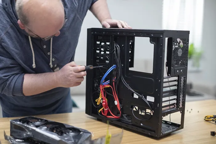 Framed Print : Repairing a Computer Print with Blurred Background Framed Print : Repairing a Computer Print with Blurred Background