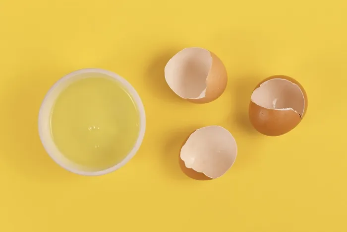 Framed Print : Egg White Print on Yellow Background with Broken Eggshells Framed Print : Egg White Print on Yellow Background with Broken Eggshells