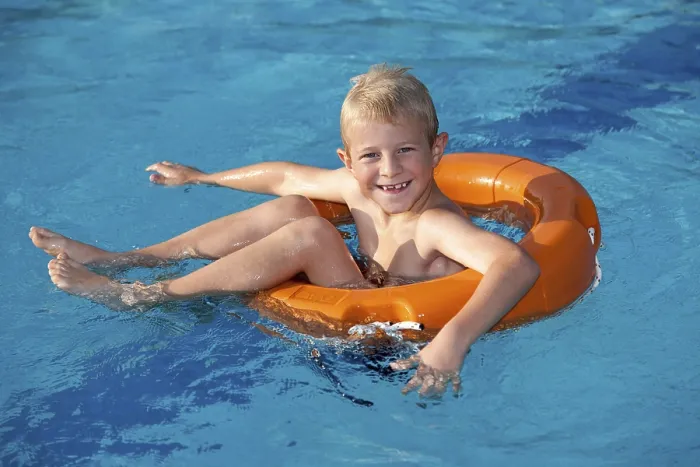 Framed Print : Boy, 7, in a pool on a life ring Print Framed Print : Boy, 7, in a pool on a life ring Print
