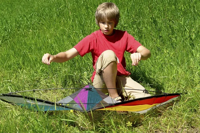 Framed Print : Boy Assembles a Stunt Kite Print Framed Print : Boy Assembles a Stunt Kite Print