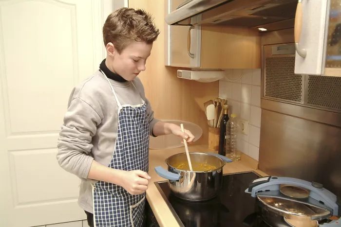 Framed Print : Boy cooks Boy, Print of a Scene from the 1960s