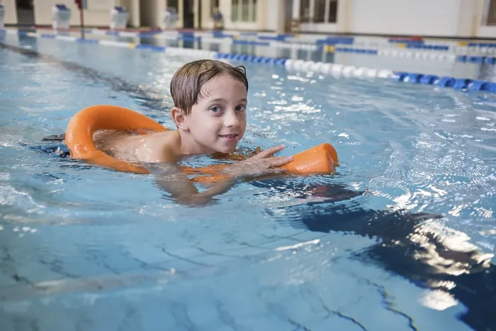 Framed Print : The Boy Learning to Swim in Indoor Pool Print