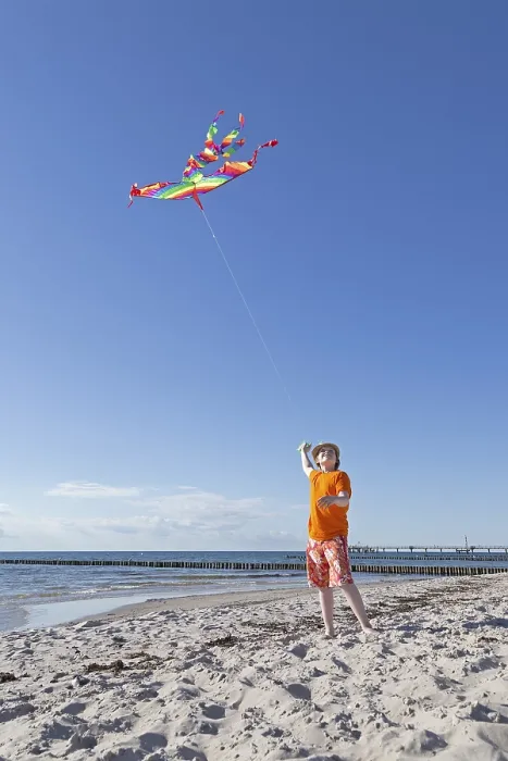 Framed Print : Boy playing with a kite on the beach Print, Wustrow, Germany Framed Print : Boy playing with a kite on the beach Print, Wustrow, Germany